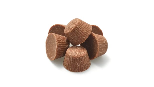 Yupik milk chocolate coated cups beside a coffee cup, great movie-night treat.