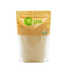 Yupik Organic Almond Meal in a jar shows a fine, light texture ideal for baking.