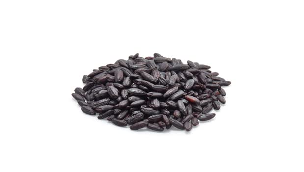 Organic Yupik black rice in a kitchen setting, ready for cooking.