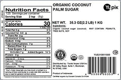 Yupik organic coconut palm sugar granules close-up highlighting amber color