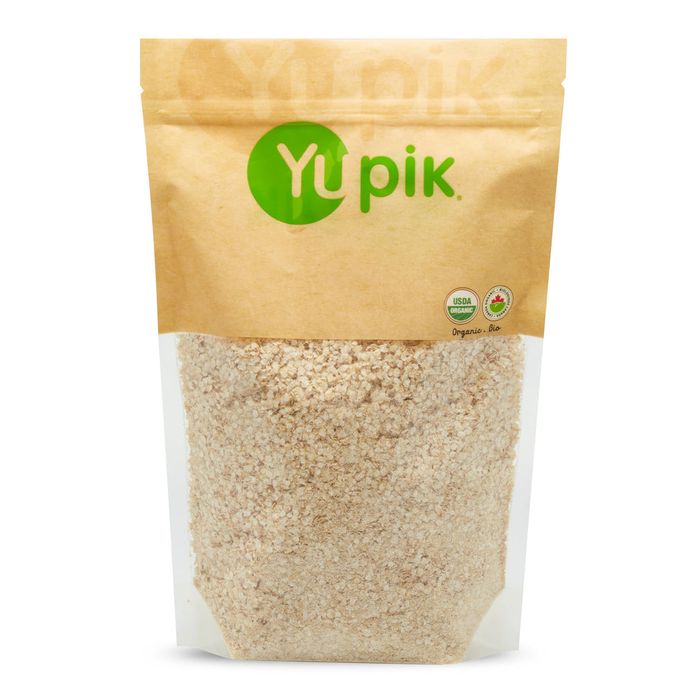 Yupik Organic White Quinoa Flakes in a bowl ready for gluten-free porridge