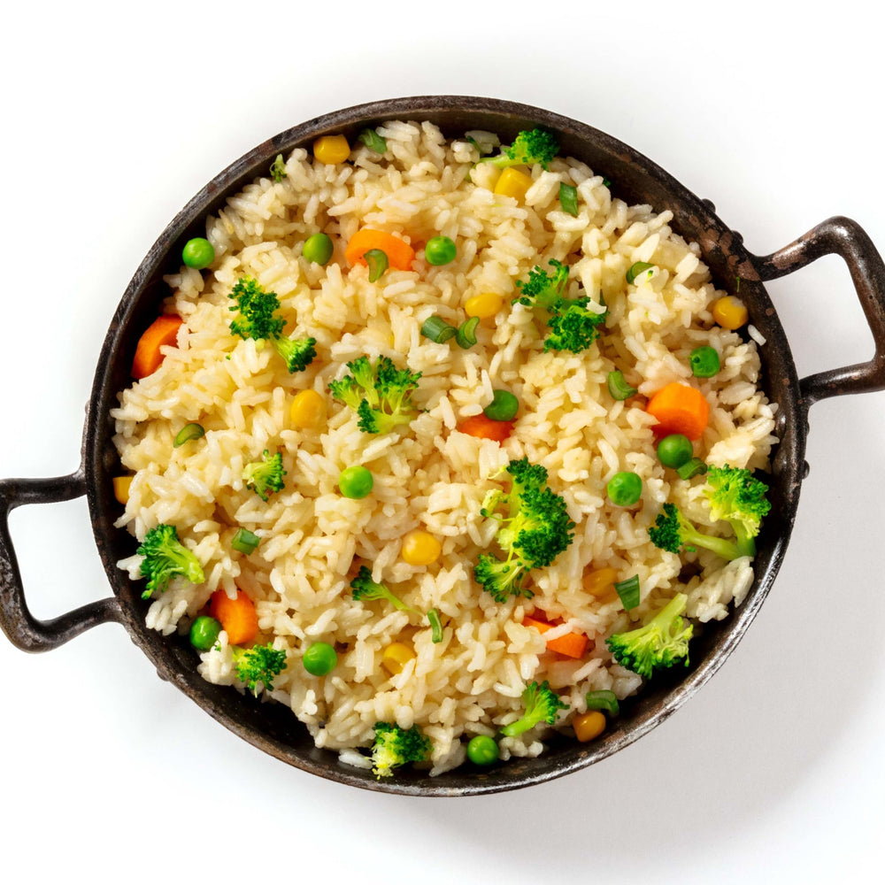 Yupik organic white rice dry grains close-up highlighting texture.