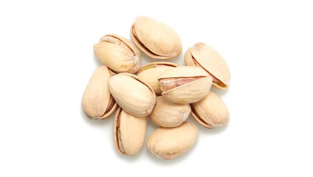 Yupik pistachios close-up showing vibrant green kernels and natural seasoning.