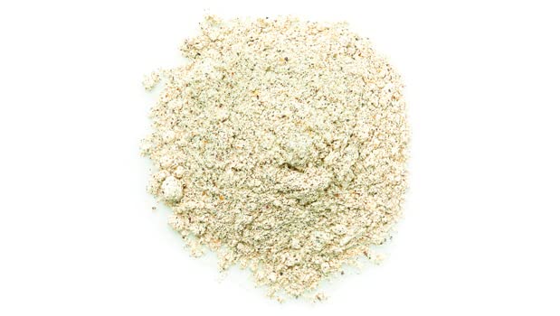 Yupik quinoa flour pours from measuring cup for smooth batter