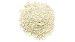 Yupik quinoa flour pours from measuring cup for smooth batter