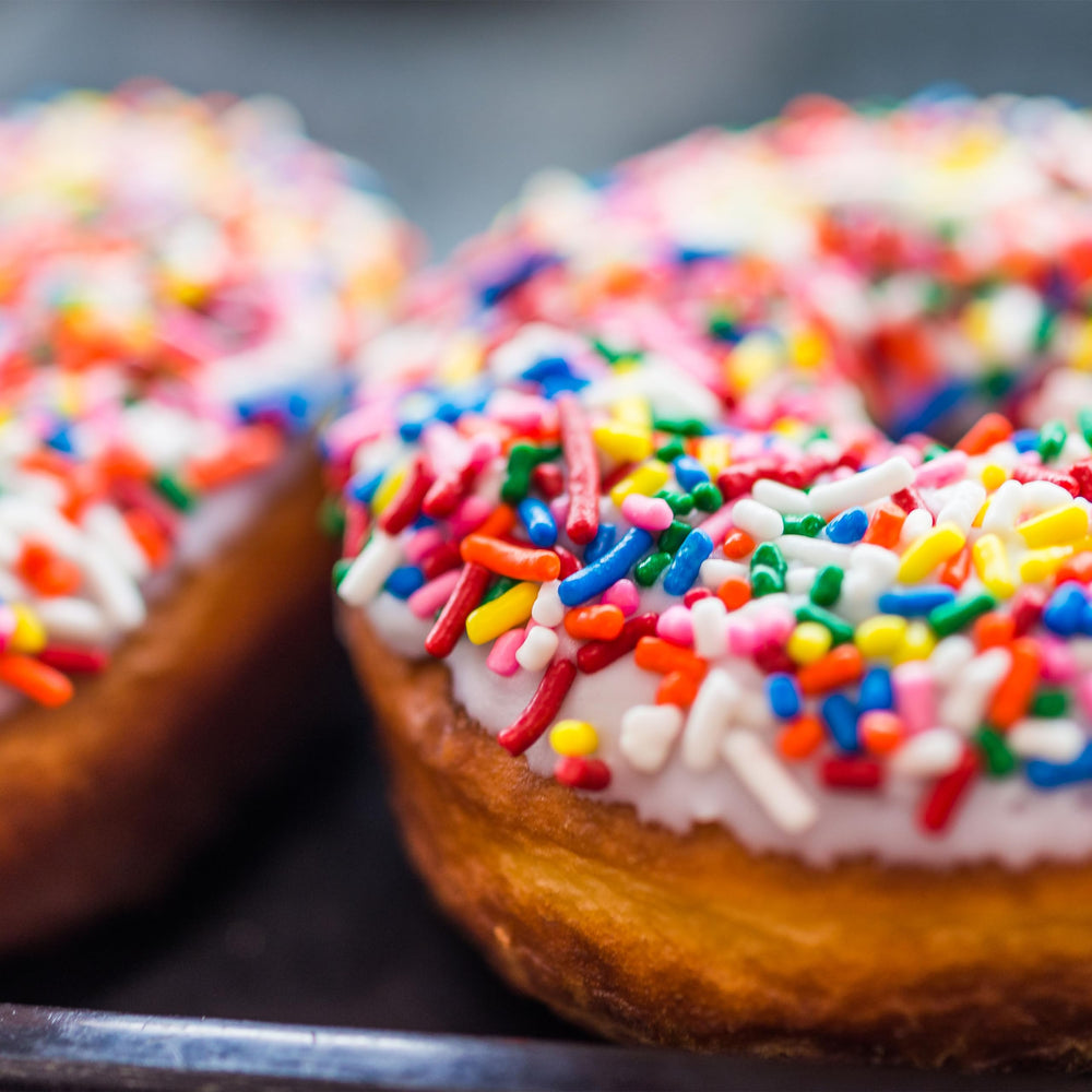 Yupik Rainbow Sprinkles top donuts for eye-catching appeal.