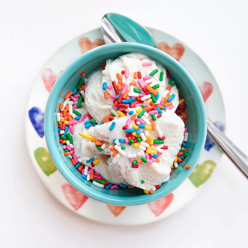 Yupik Rainbow Sprinkles storage bottle shown with vibrant colors.