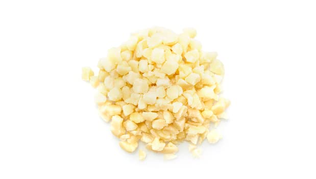 Yupik skinless almonds cubes in a bowl, great as a crunchy snack or recipe ingredient