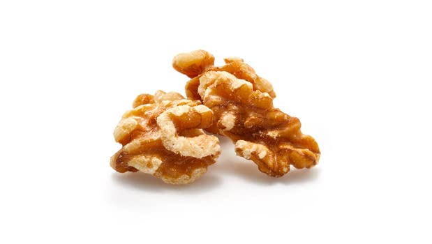 Close-up of creamy, buttery walnuts with a crunchy texture.