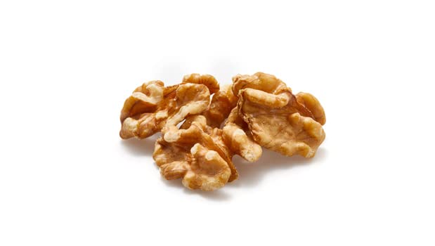 Yupik walnuts halves in a bowl for topping salads