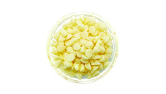 Yupik white chocolate chips melted droplets showing cocoa butter richness.