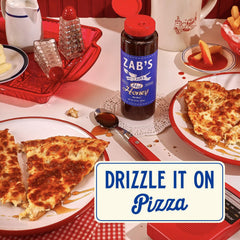Zab's Hot Honey on a cheese board enhances flavor with floral warmth