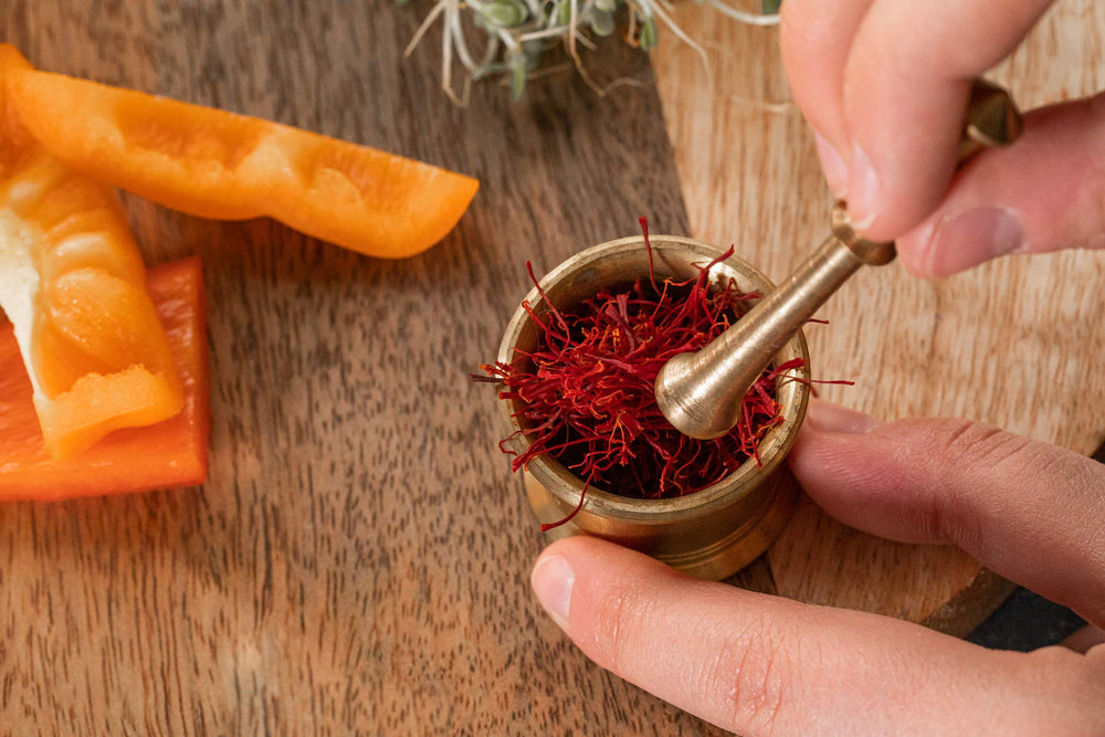 Zaffrus saffron in paella and rice dishes adding warm, aromatic color.