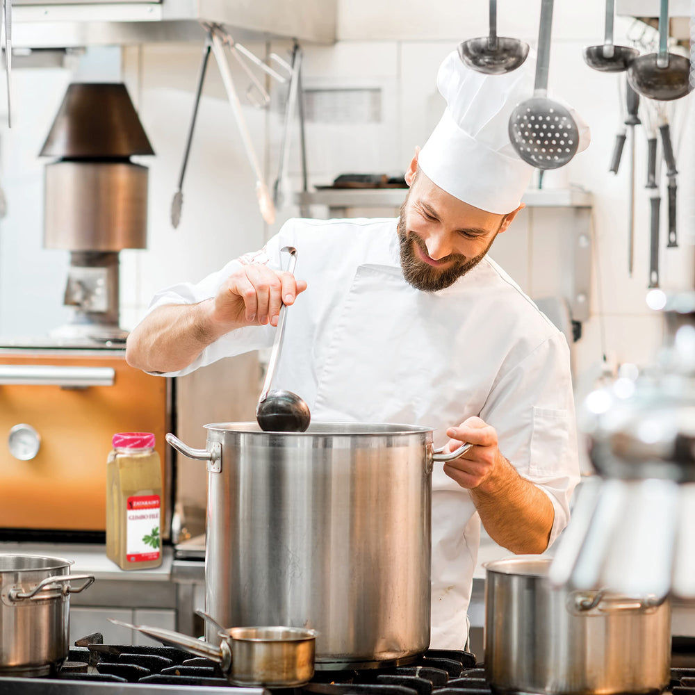 Pouring Zatarain's Gumbo Filé powder to boost aroma and body.