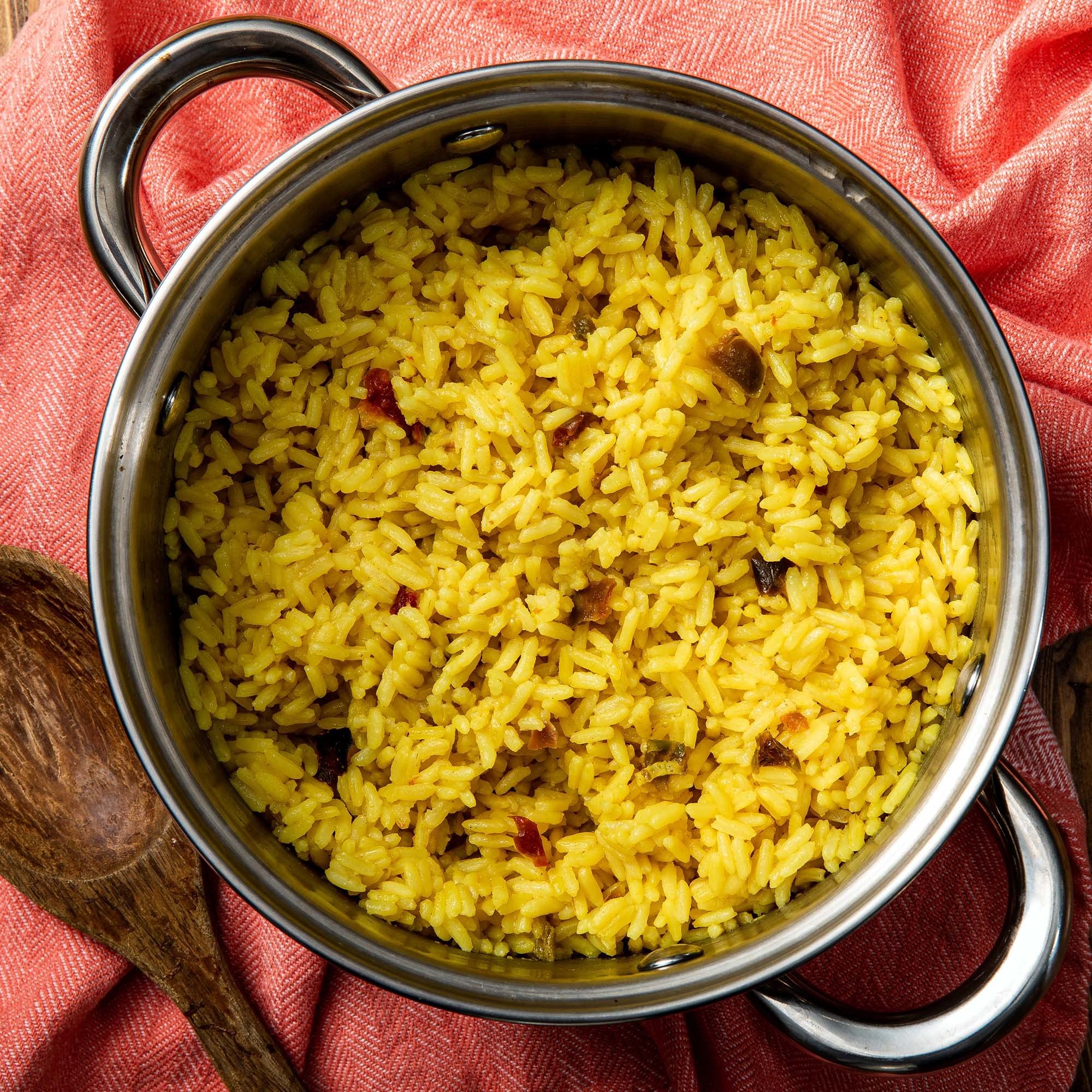 Zatarain's Yellow Rice served with chicken, a versatile base for dinners.