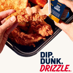 Zax Sauce on burger topping shot, savory drizzle over sandwich.