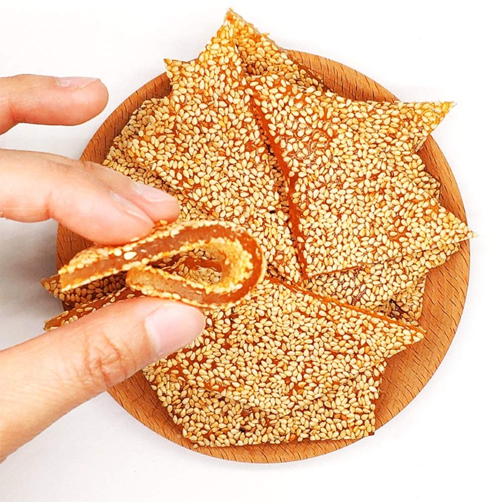 zhai-ji-di HelenOu666 soft-sticky sesame candy on plate for sharing