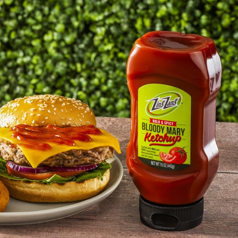 Close-up of Zing Zang Bloody Mary ketchup label highlighting tomato and vegetable juice blend.