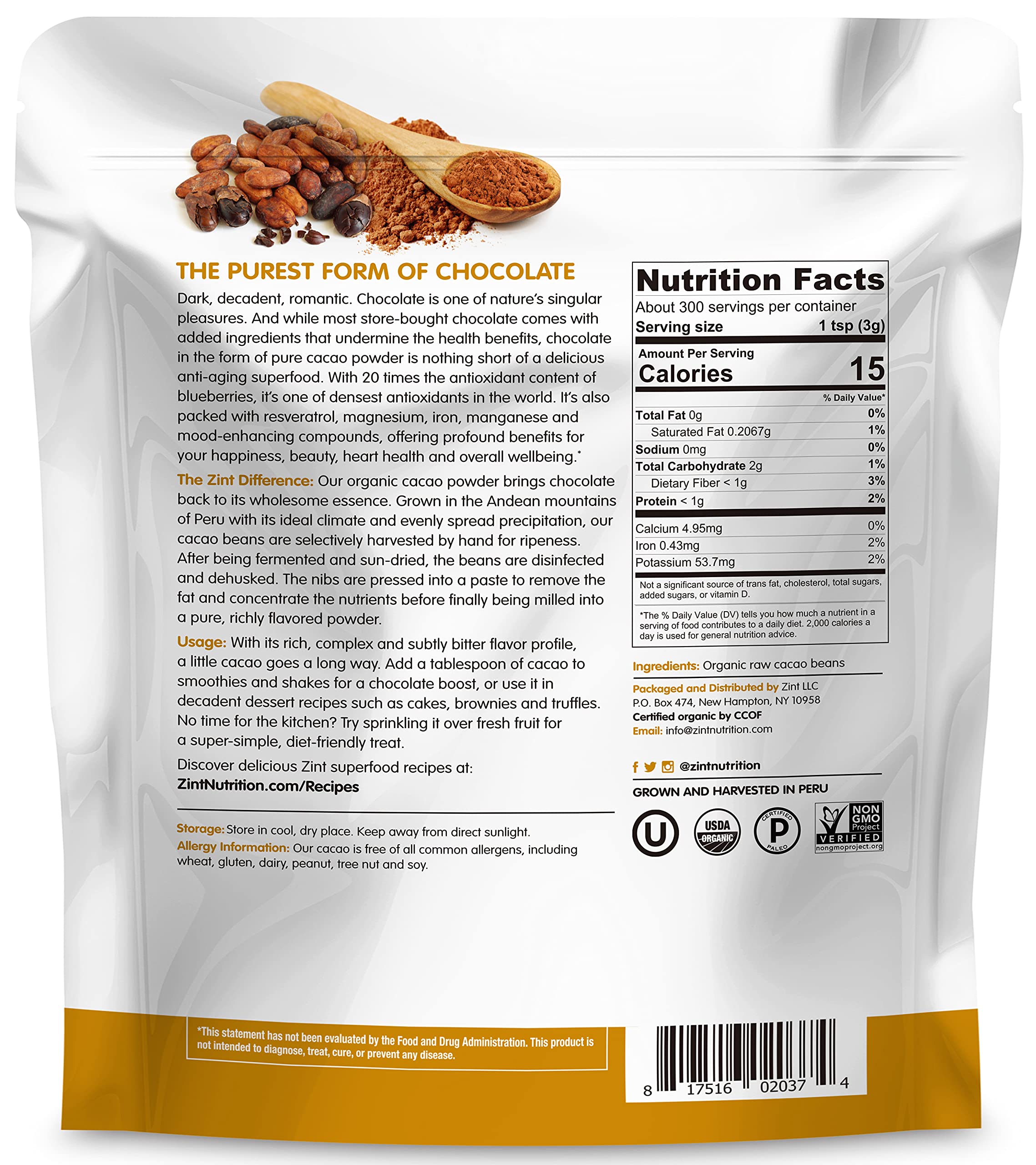 Zint cacao powder scoop in a glass cup, perfect for shakes and desserts.