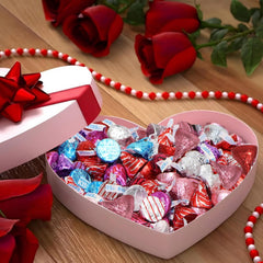 Assorted red, pink, and white wrappers showing Valentine’s theme