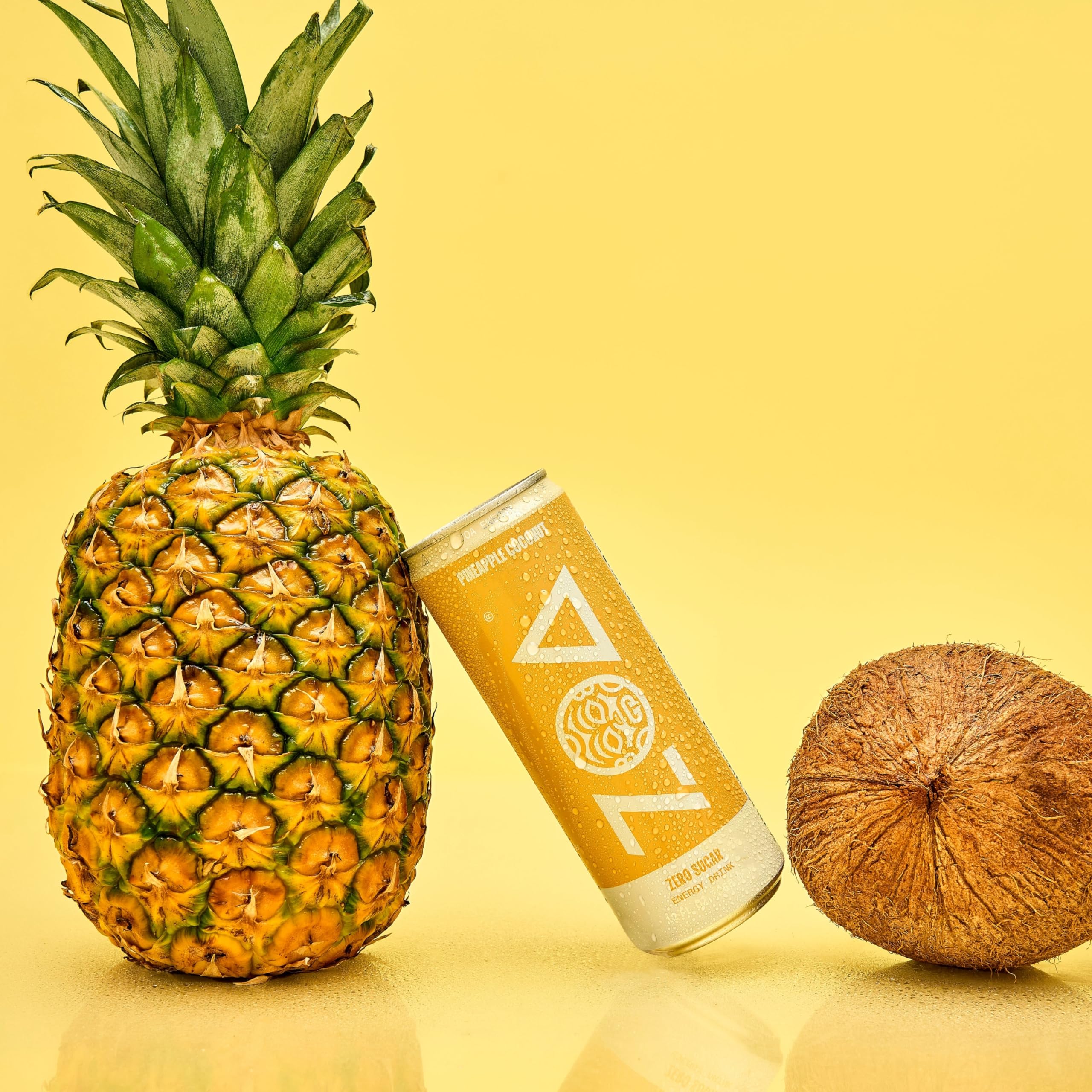 ZOA Pineapple Coconut bottle closeup features natural caffeine from green tea.