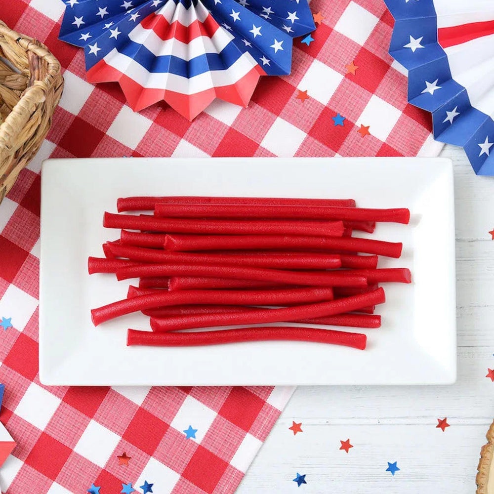 Office candy bowls featuring RedVinnes licorice ropes for quick snacking.
