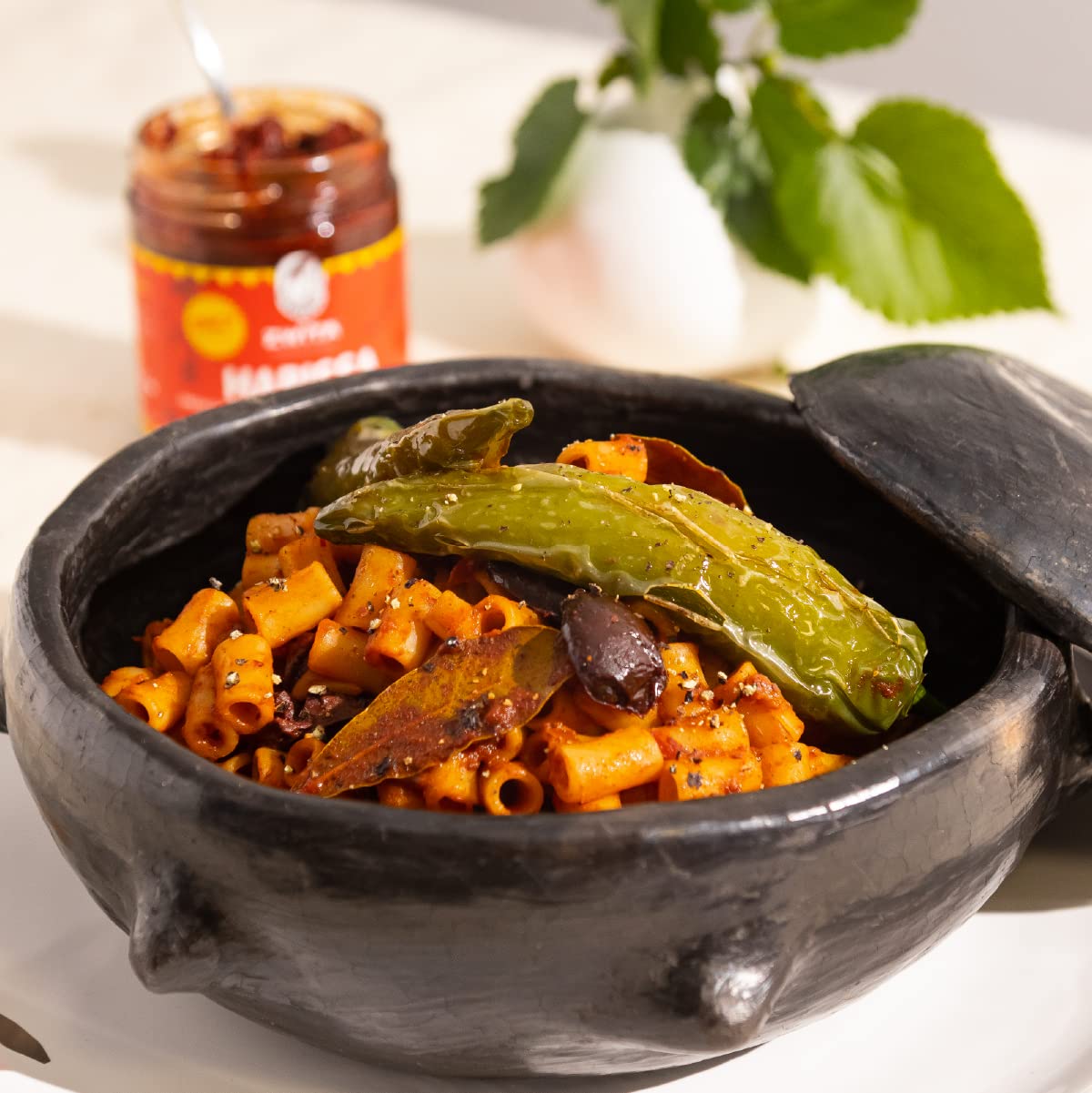 Zwïta Mild Harissa served with bread and olive oil evokes authentic immersion.