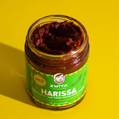 Zwïta Mild Harissa olive oil pour suggests premium ingredients ready to blend.